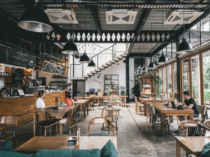 An empty café dining room with large windows
